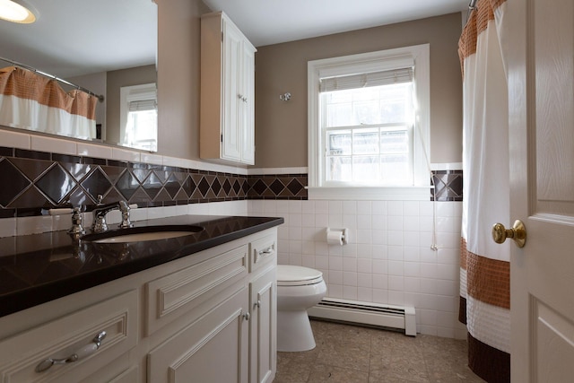 full bathroom with tile patterned flooring, toilet, vanity, tile walls, and a baseboard radiator