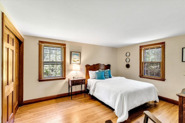 3 Five Corners Rd, Centerville, MA 02632 - bedroom with light wood-style flooring, multiple windows, and a closet