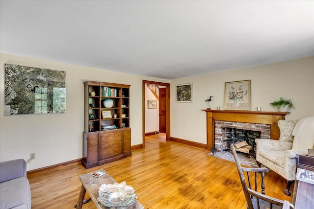 3 Five Corners Rd, Centerville, MA 02632 - living room with light wood-style floors and a fireplace