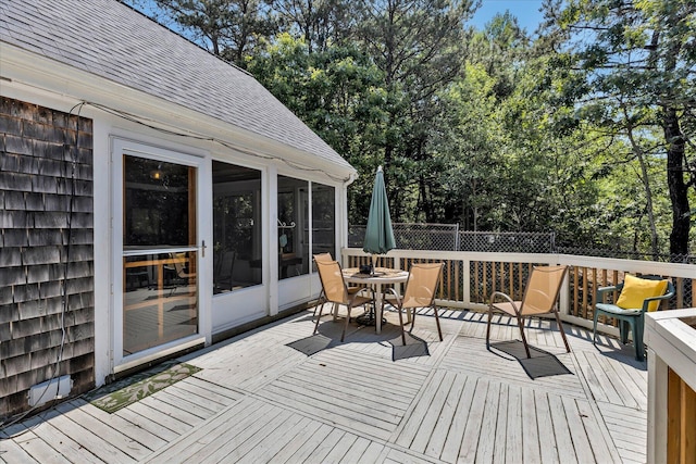 3 Five Corners Rd, Centerville, MA 02632 - deck featuring outdoor dining space, a sunroom, and view of scattered trees
