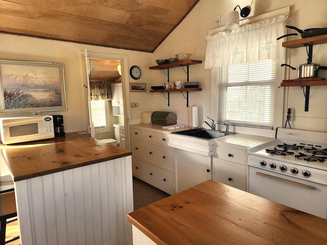 kitchen featuring vaulted ceiling, wooden counters, white cabinets, wood ceiling, and white appliances