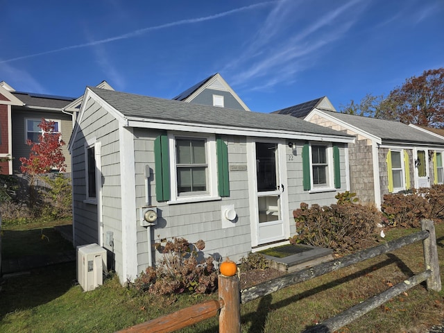 view of front of property featuring ac unit