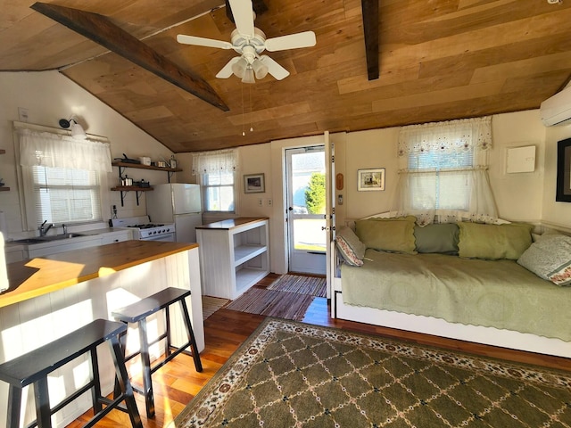 bedroom featuring wood-type flooring, white fridge, vaulted ceiling with beams, sink, and wooden ceiling