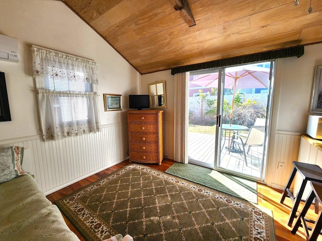 interior space with wooden ceiling, hardwood / wood-style floors, a wall unit AC, and lofted ceiling