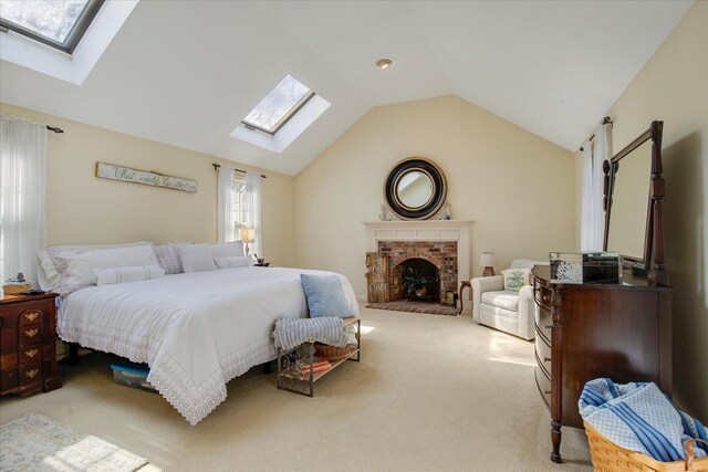 carpeted bedroom featuring a skylight and lofted ceiling