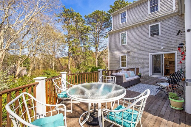 deck with outdoor dining area and an outdoor living space