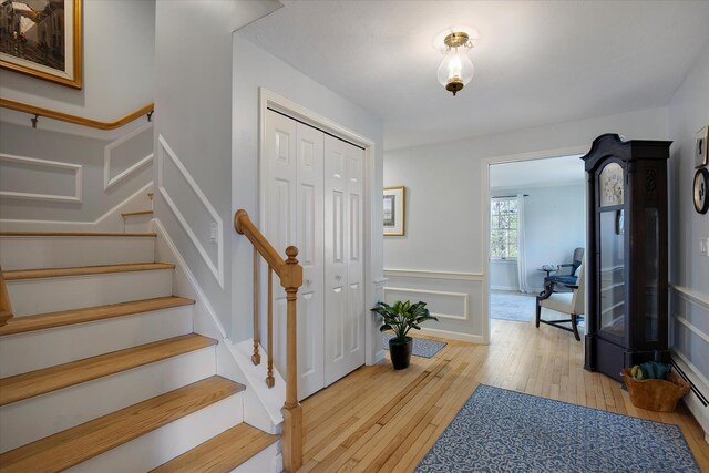 entrance foyer featuring hardwood / wood-style flooring and stairs