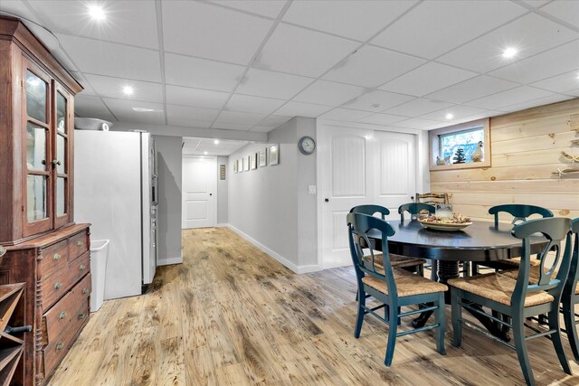 dining space with light wood finished floors, baseboards, and recessed lighting