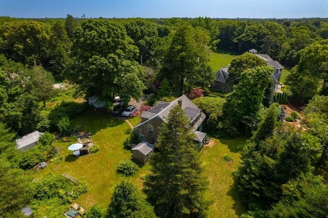 aerial overview of property's location with a heavily wooded area