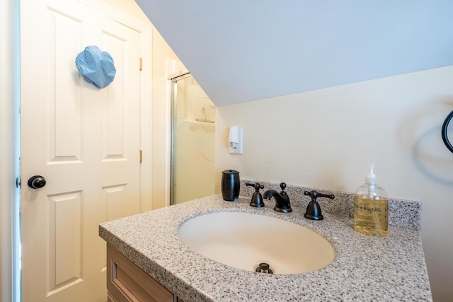 67 Inman Rd Unit X, Dennis Port, MA 02639 - bathroom featuring vanity and vaulted ceiling