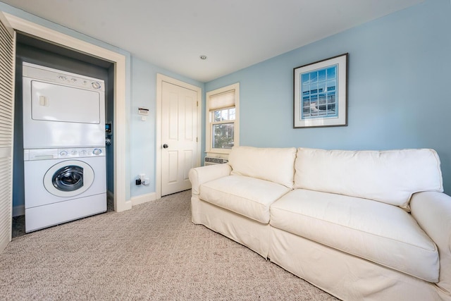 67 Inman Rd Unit X, Dennis Port, MA 02639 - living room with stacked washer and dryer and carpet