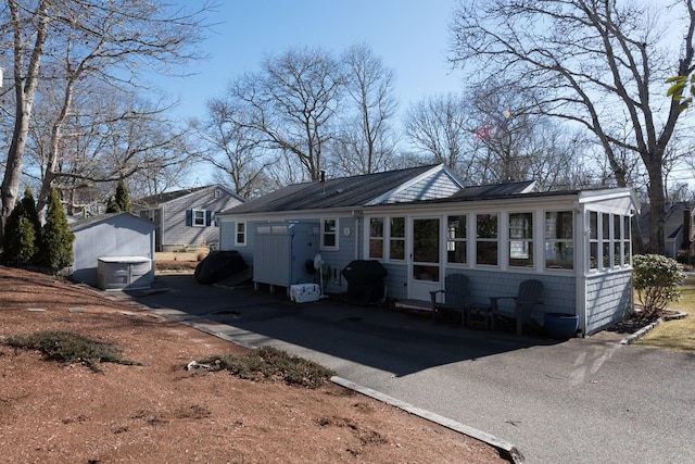 2 Naushon Rd, Mashpee, MA 02649 - back of house featuring a sunroom