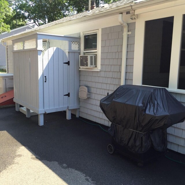 2 Naushon Rd, Mashpee, MA 02649 - property entrance featuring roof with shingles
