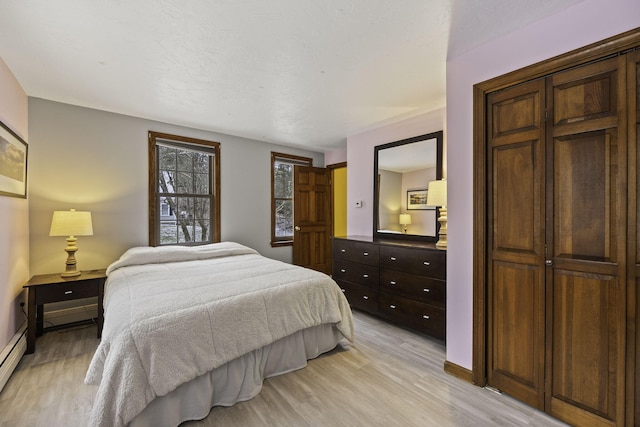 bedroom with light hardwood / wood-style floors