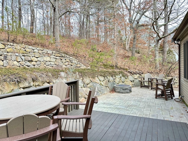 wooden deck featuring an outdoor fire pit