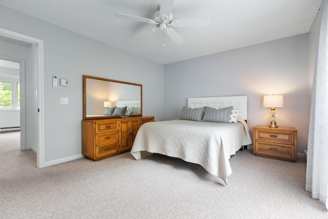 288 Fletcher Ln, Brewster, MA 02631 - bedroom with light colored carpet, baseboard heating, and ceiling fan