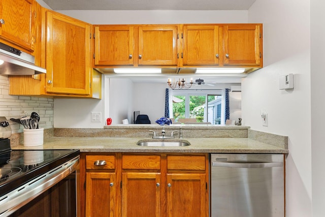 288 Fletcher Ln, Brewster, MA 02631 - kitchen featuring stainless steel appliances, under cabinet range hood, decorative backsplash, and brown cabinets