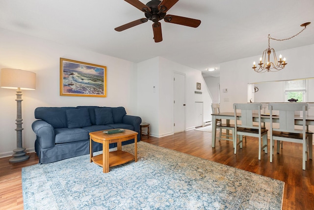 288 Fletcher Ln, Brewster, MA 02631 - living area featuring wood finished floors, ceiling fan, and a chandelier