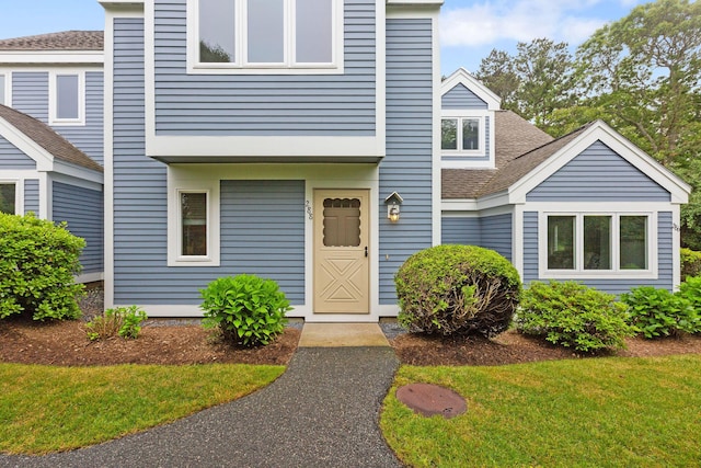 288 Fletcher Ln, Brewster, MA 02631 - view of front facade featuring roof with shingles and a front lawn