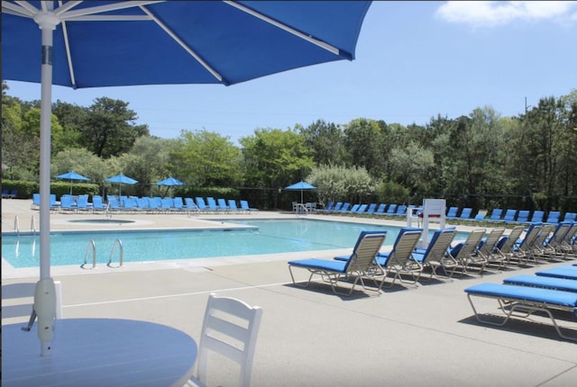 288 Fletcher Ln, Brewster, MA 02631 - community pool featuring a patio area and view of scattered trees