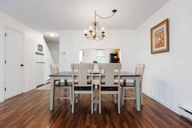288 Fletcher Ln, Brewster, MA 02631 - dining room featuring baseboard heating, wood finished floors, and a chandelier