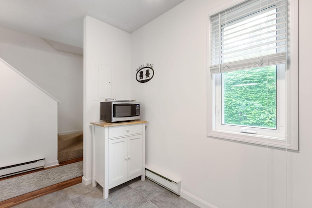 288 Fletcher Ln, Brewster, MA 02631 - detailed view of a baseboard radiator and stainless steel microwave
