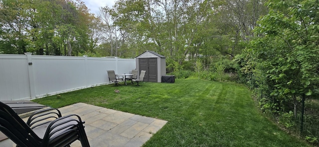 46B Beach Rd Unit 2, West Yarmouth, MA 02673 - fenced backyard featuring a storage shed and a patio area