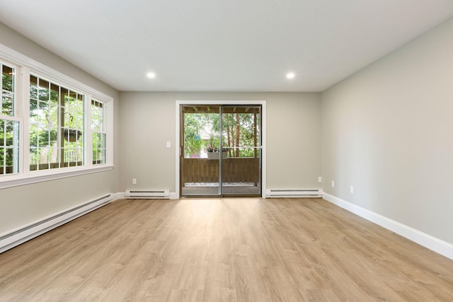 1029 Iyannough Rd Unit 9B, Hyannis, MA 02601 - unfurnished room featuring baseboard heating, a baseboard heating unit, light wood-style floors, and recessed lighting