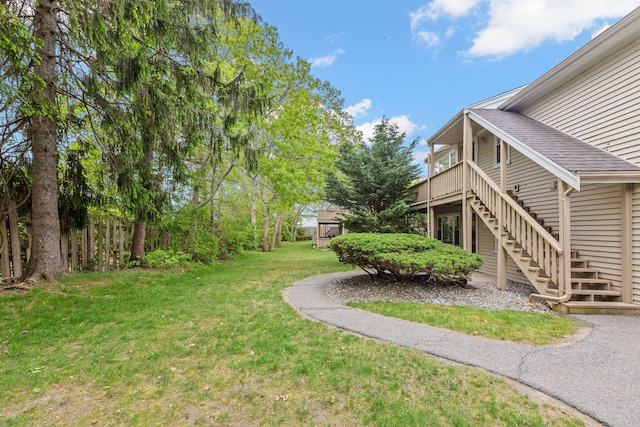 1029 Iyannough Rd Unit 9B, Hyannis, MA 02601 - view of green lawn featuring stairs and a wooden deck