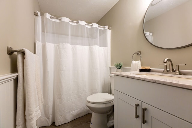 1029 Iyannough Rd Unit 9B, Hyannis, MA 02601 - bathroom featuring vanity, toilet, wood finished floors, and a shower with curtain