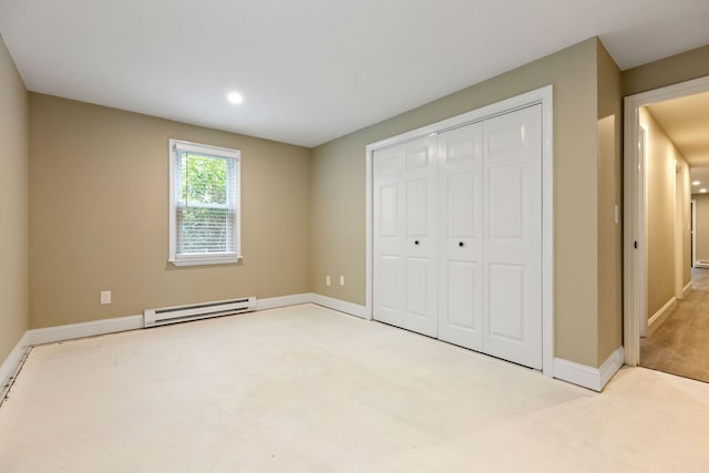 1029 Iyannough Rd Unit 9B, Hyannis, MA 02601 - unfurnished bedroom with a baseboard heating unit, a closet, baseboards, and recessed lighting