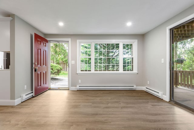 1029 Iyannough Rd Unit 9B, Hyannis, MA 02601 - entryway with a baseboard heating unit, wood finished floors, recessed lighting, and baseboards