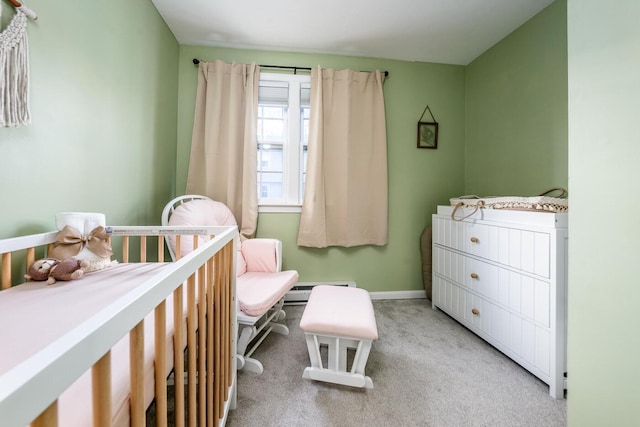 carpeted bedroom with a baseboard heating unit