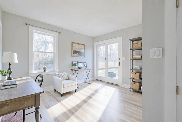 office area with light hardwood / wood-style flooring