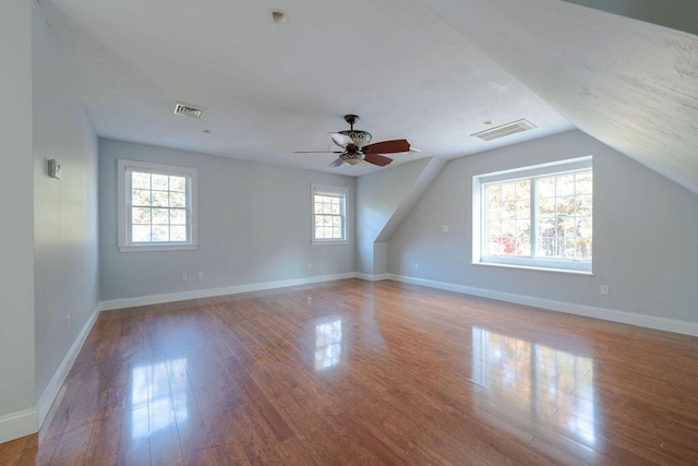 additional living space featuring ceiling fan, lofted ceiling, and wood-type flooring