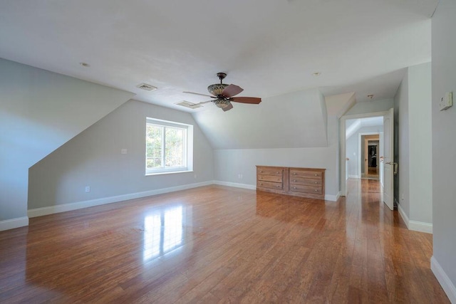 bonus room featuring ceiling fan, wood-type flooring, and vaulted ceiling