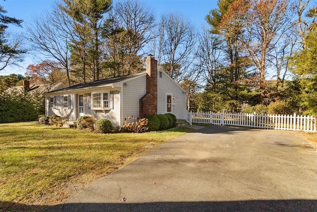 view of home's exterior featuring a lawn