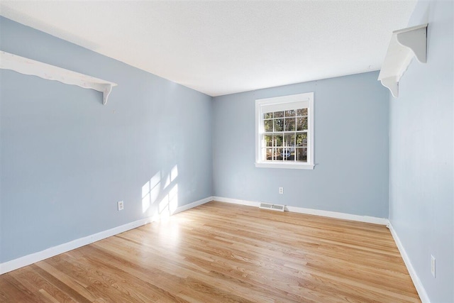 empty room featuring light hardwood / wood-style floors