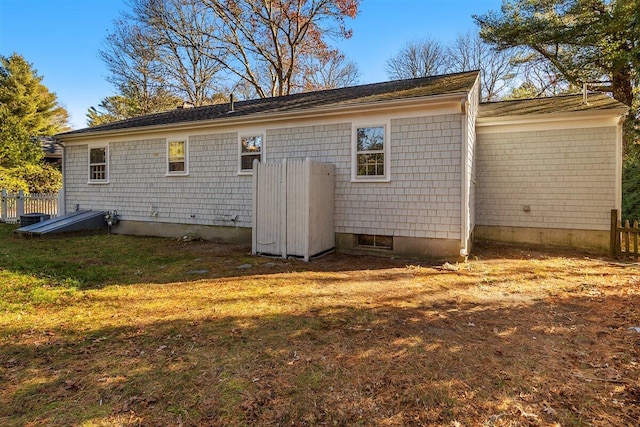 view of side of property featuring a yard