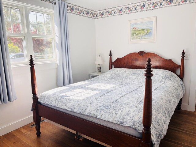 69 Captain Chase Rd, Dennis Port, MA 02639 - bedroom with wood-type flooring and baseboards
