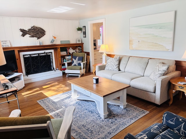 69 Captain Chase Rd, Dennis Port, MA 02639 - living room featuring wood finished floors and a fireplace with raised hearth