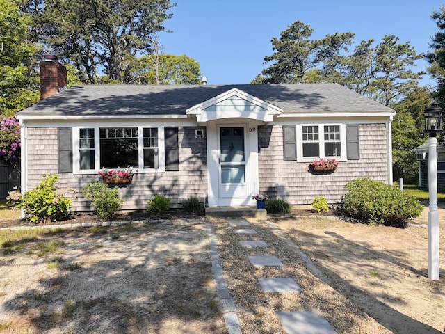 69 Captain Chase Rd, Dennis Port, MA 02639 - view of front facade with a chimney