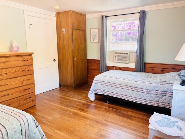 69 Captain Chase Rd, Dennis Port, MA 02639 - bedroom with light wood-type flooring, cooling unit, a wainscoted wall, and wooden walls