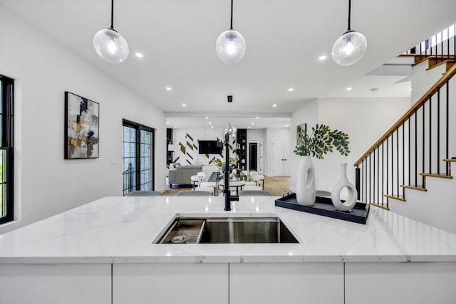 2 Buttercup Ln, South Yarmouth, MA 02664 - kitchen featuring open floor plan, recessed lighting, pendant lighting, wood finished floors, and white cabinets
