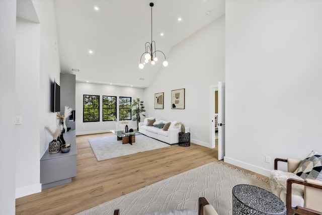 2 Buttercup Ln, South Yarmouth, MA 02664 - living area with high vaulted ceiling, light wood-style flooring, a chandelier, and recessed lighting