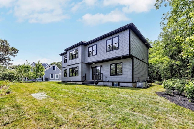 2 Buttercup Ln, South Yarmouth, MA 02664 - back of property featuring a lawn