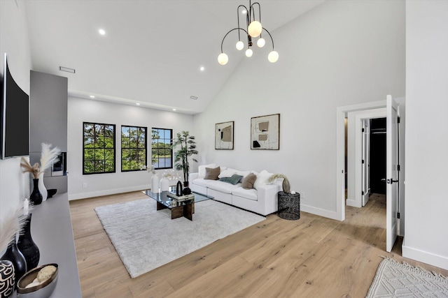 2 Buttercup Ln, South Yarmouth, MA 02664 - living area with high vaulted ceiling, recessed lighting, light wood-type flooring, and a chandelier