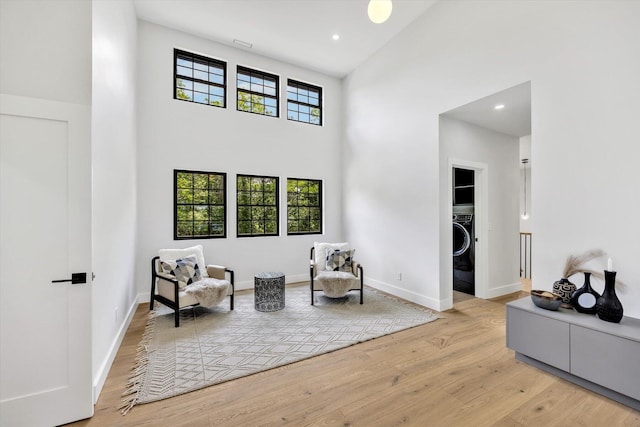 2 Buttercup Ln, South Yarmouth, MA 02664 - living area with a towering ceiling, wood finished floors, washer / dryer, and recessed lighting