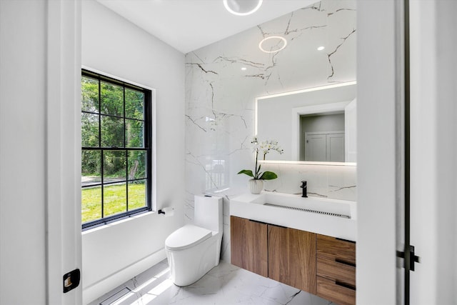 2 Buttercup Ln, South Yarmouth, MA 02664 - bathroom featuring marble finish flooring, vanity, and plenty of natural light