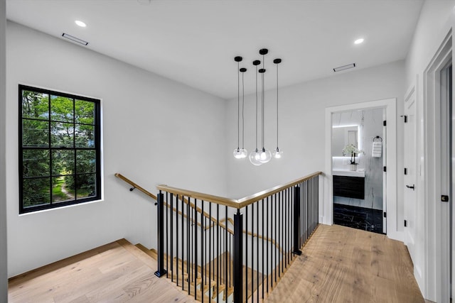 2 Buttercup Ln, South Yarmouth, MA 02664 - hallway featuring an upstairs landing, light wood-style floors, and recessed lighting